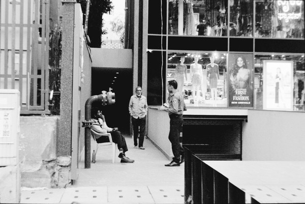 I like the images of 3 people standing around, also the 3 mannequins make it interesting to me. The person sitting on the chair also seems to be instructing others